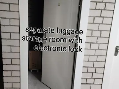 a garage door with an electronic lock at HaPPy Inn Ugnė, The studio is in the heart of the old town, self-check-in, car-parking in Vilnius