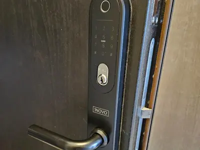a close up of a door with a remote control at HaPPy Inn Ugnė, The studio is in the heart of the old town, self-check-in, car-parking in Vilnius