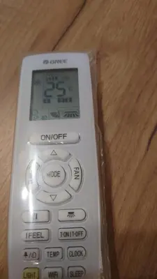 a remote control sitting on top of a wooden table at Druskininkų Pasaga in Druskininkai