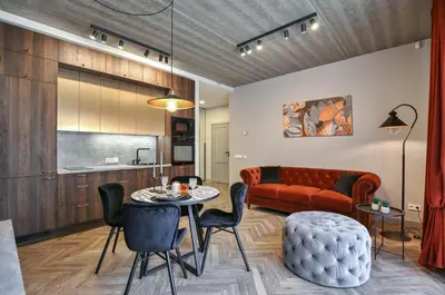 a living room with a couch and a table at cohost I Nicely Designed NEW Apt w-Garage Parking & Self Check-in in Vilnius