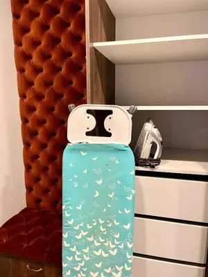 a suitcase sitting on a shelf in a kitchen at cohost I Nicely Designed NEW Apt w-Garage Parking & Self Check-in in Vilnius