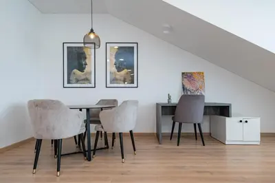 a dining room with a table and chairs at Spaciuos 1 BD Apt by Domvia in Kaunas