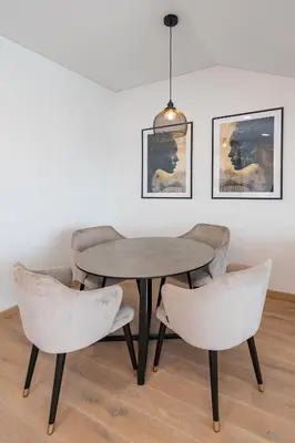 a table and four chairs in a room at Spaciuos 1 BD Apt by Domvia in Kaunas