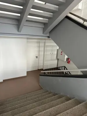 a staircase in a building with a stair case at Kaunas apartments near Bus station in Kaunas
