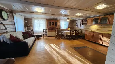 a living room with a couch and a table at Authentic homestead over 100 years old in Kėdainiai