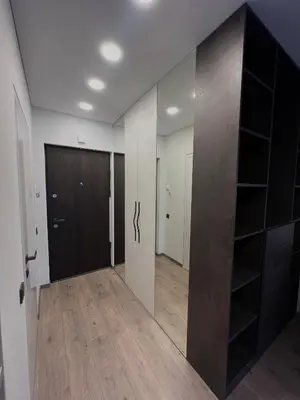 an empty hallway with a door and a closet at J.Kairiūkščio apartamentai in Vilnius
