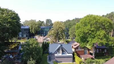 an aerial view of a residential neighborhood with houses at Rytas cozy apartment in the guest house with the terrace and the stunning view to the river side in Birštonas