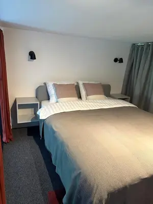 a bedroom with a large bed in a room at M Loft2 in Kaunas