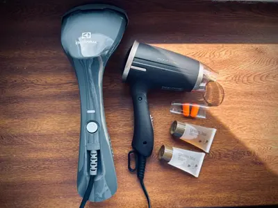 a hair dryer and a blow dryer on a table at Lovely Stay in Siauliai in Šiauliai