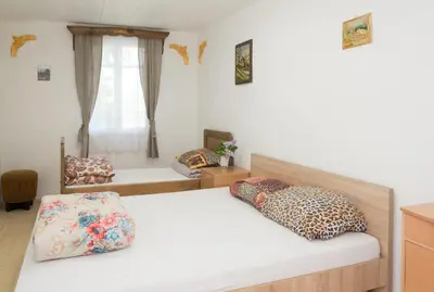 a bedroom with a bed with two pillows on it at Skiemonių Dvaras in Skiemonys