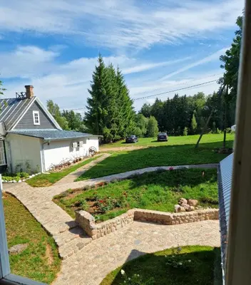 a view of a garden from the window of a house at Skiemonių Dvaras in Skiemonys