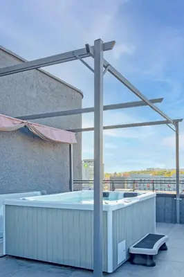 a hot tub on the roof of a building at Apartments in Kaunas city centre with Jacuzzi bath in Kaunas