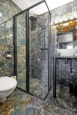 a bathroom with a shower and a toilet at Apartments in Kaunas city centre with Jacuzzi bath in Kaunas