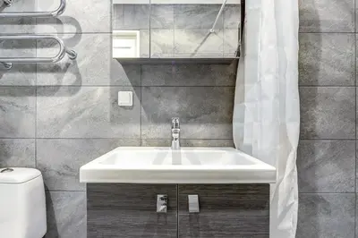 a bathroom with a sink and a toilet at 22 Airport Apartment in Vilnius