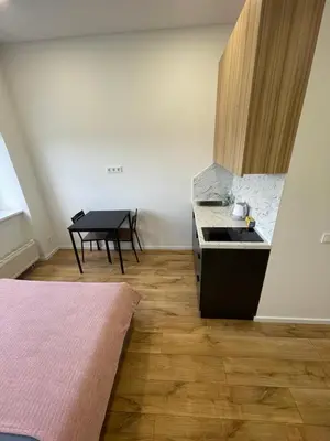 a kitchen with a sink and a table in it at 22 Airport Apartment in Vilnius