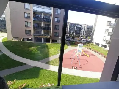a view from a window of a playground at Erdvi studija Spacious studio apartment Self check in in Vilnius