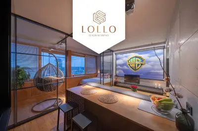 a room with a view of the lotto sign on the window at Vivulskio Apartament - Lollo Stay in Vilnius