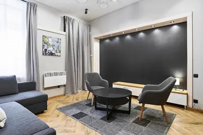 a living room with a blackboard on the wall at Cosy and authentic apartment in Vilnius Old Town in Vilnius