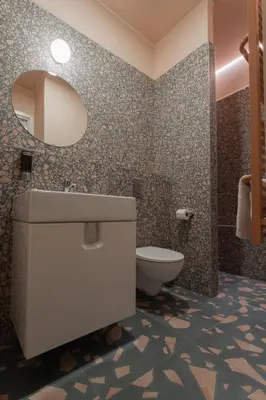 a bathroom with a sink and a toilet at Resume apartments in Kaunas