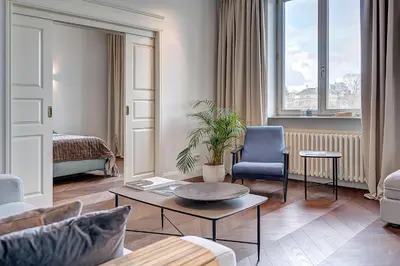 a living room with a couch and a table at Vilnius Apartments & Suites - Gedimino avenue in Vilnius