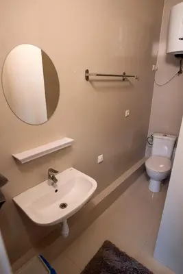 a bathroom with a sink and a toilet at Main Street Šiauliai, City Center in Šiauliai