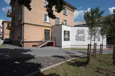 a building with a mural on the side of it at Main Street Šiauliai, City Center in Šiauliai