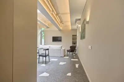 an office lobby with a table and chairs at Apartamentai Astra in Druskininkai