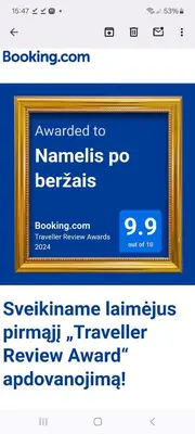 a screenshot of a website with a picture in a frame at Namelis po beržais in Marijampolė