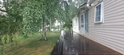 a rain soaked porch of a house at Namelis po beržais in Marijampolė