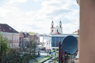 a view of a city with a clock tower at V 13 - 3 BDR Balcony, Views - Courtyard n Vokiečių in Vilnius
