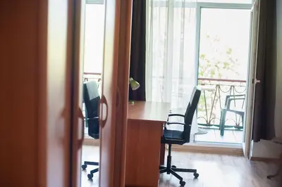 an office with a desk and two chairs and a window at V 13 - 3 BDR Balcony, Views - Courtyard n Vokiečių in Vilnius
