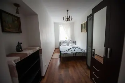 a bedroom with a bed and a window at V 18 - Superior & Great views to Vokieciu street in Vilnius