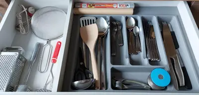 a drawer filled with utensils and utensils at Patogus poilsis prie ežero/Comfortable rest in Visaginas