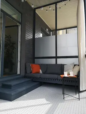 a living room with a couch and a table at Parko rezidencija apartments - SELF CHECK-IN in Panevėžys