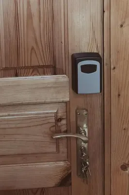 a wooden door with a lock on it at Rokiskis- jaukus butas su balkonu in Rokiškis