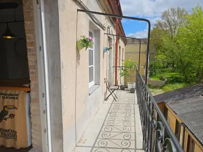 a balcony of a house with a window at Paupio Gertruda in Vilnius
