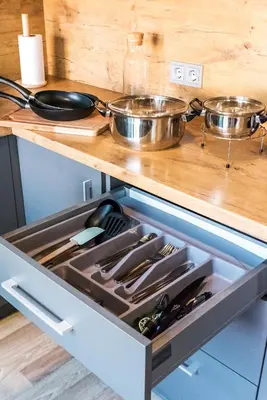 a drawer in a kitchen with two pots and pans at Karaliaus apartment in Kaunas