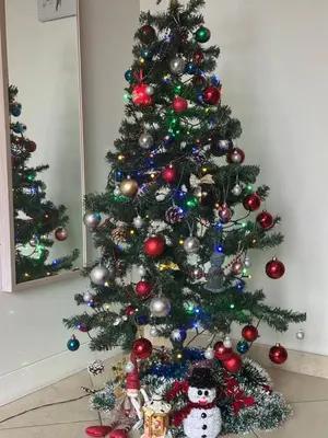 a christmas tree with christmas ornaments on it at Pilaites svetingi namai in Vilnius