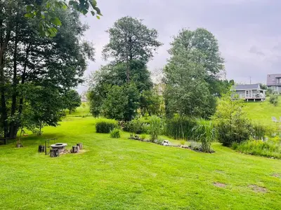 a park with a picnic table in the grass at Gandro lizdas in Lekėčiai
