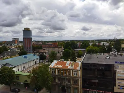 an aerial view of a city with a water tower at Itaja Apartment 91 in Šiauliai