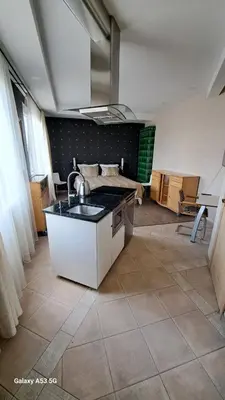 a kitchen with a sink and a counter top at KaunasInn in Kaunas