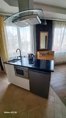 a kitchen with a sink and a counter top at KaunasInn in Kaunas