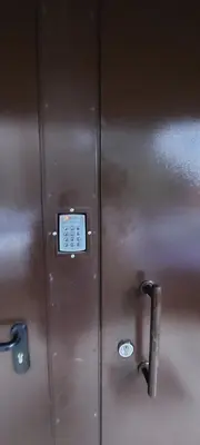 a metal locker door with a control panel on it at DIVA contactless check in & out in Šiauliai