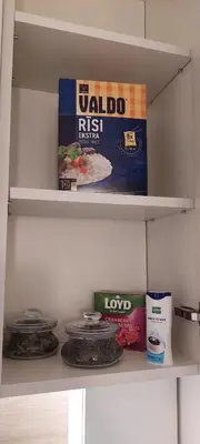 a shelf in a refrigerator with some food on it at DIVA contactless check in & out in Šiauliai