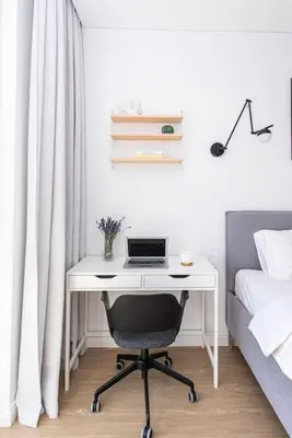 a desk with a laptop computer on it in a bedroom at 1bdr Apt w/Balcony, free Pkg in Vilnius