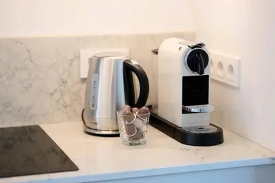 a coffee maker sitting on a counter next to a toaster at 1bdr Apt w/Balcony, free Pkg in Vilnius