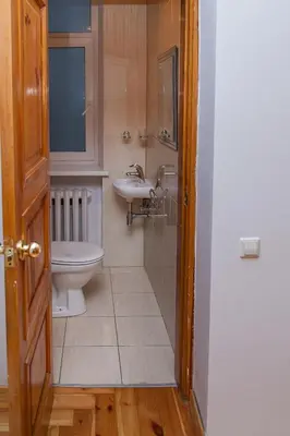 a bathroom with a toilet and a sink at KaunasInn - AM in Kaunas
