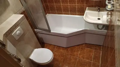 a bathroom with a toilet and a tub and a sink at Visaginas Taikos 84 in Visaginas