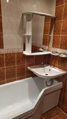 a bathroom with a white sink and a mirror at Visaginas Taikos 84 in Visaginas