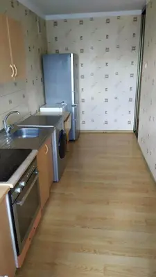 a kitchen with a sink and a refrigerator at Visaginas Taikos 84 in Visaginas